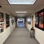 Brightly lit school hallway at Brentwood Middle School, showcasing energy-efficient LED lighting retrofitted by Colorado Controls