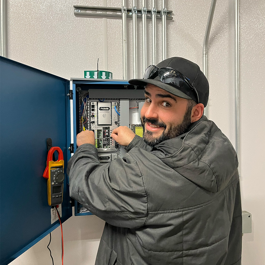 Facility manager adjusting the smart heating control parameters on a tablet connected to the BAS